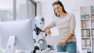 Canva Image AI robot and Girl at desk in front of computer